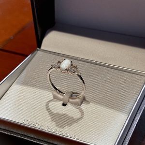 Sterling Silver Primrose ring with White Opal and Cubic Zirconia accents